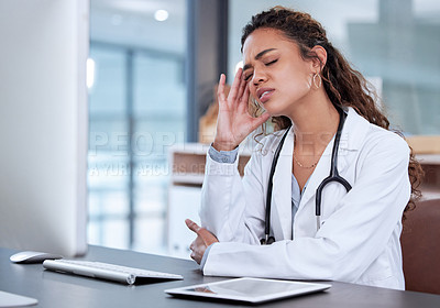 Buy stock photo Doctor, pain and woman with headache at desk for burnout, stress and tension in hospital office. Tired, medical professional and problem at clinic with injury for fatigue, frustrated and overworked