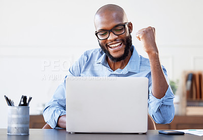 Buy stock photo Shot of a businessman looking cheerful while working on his laptop in his office