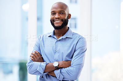Buy stock photo Portrait shot of a young businessman standing in his office
