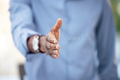 Buy stock photo Cropped shot of a businessman reaching out for a handshake
