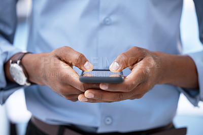 Buy stock photo Cropped shot of a businessman using his cellphone