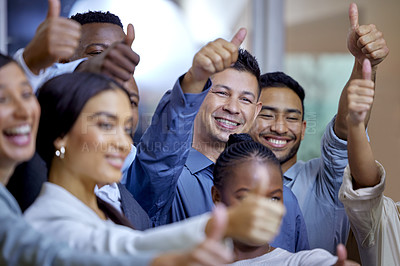 Buy stock photo Shot of a group of businesspeople showing the thumbs up in a modern office