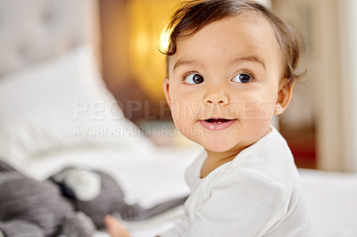 Buy stock photo Shot of a little baby playing by herself on the bed