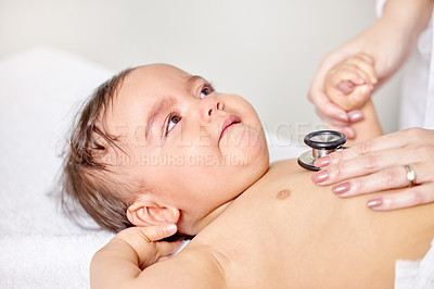 Buy stock photo Sick baby, scared and doctor hands with stethoscope for check up, healthcare and illness in family clinic. Child, female physician and hospital bed for sad kid, medical aid and pediatrician 