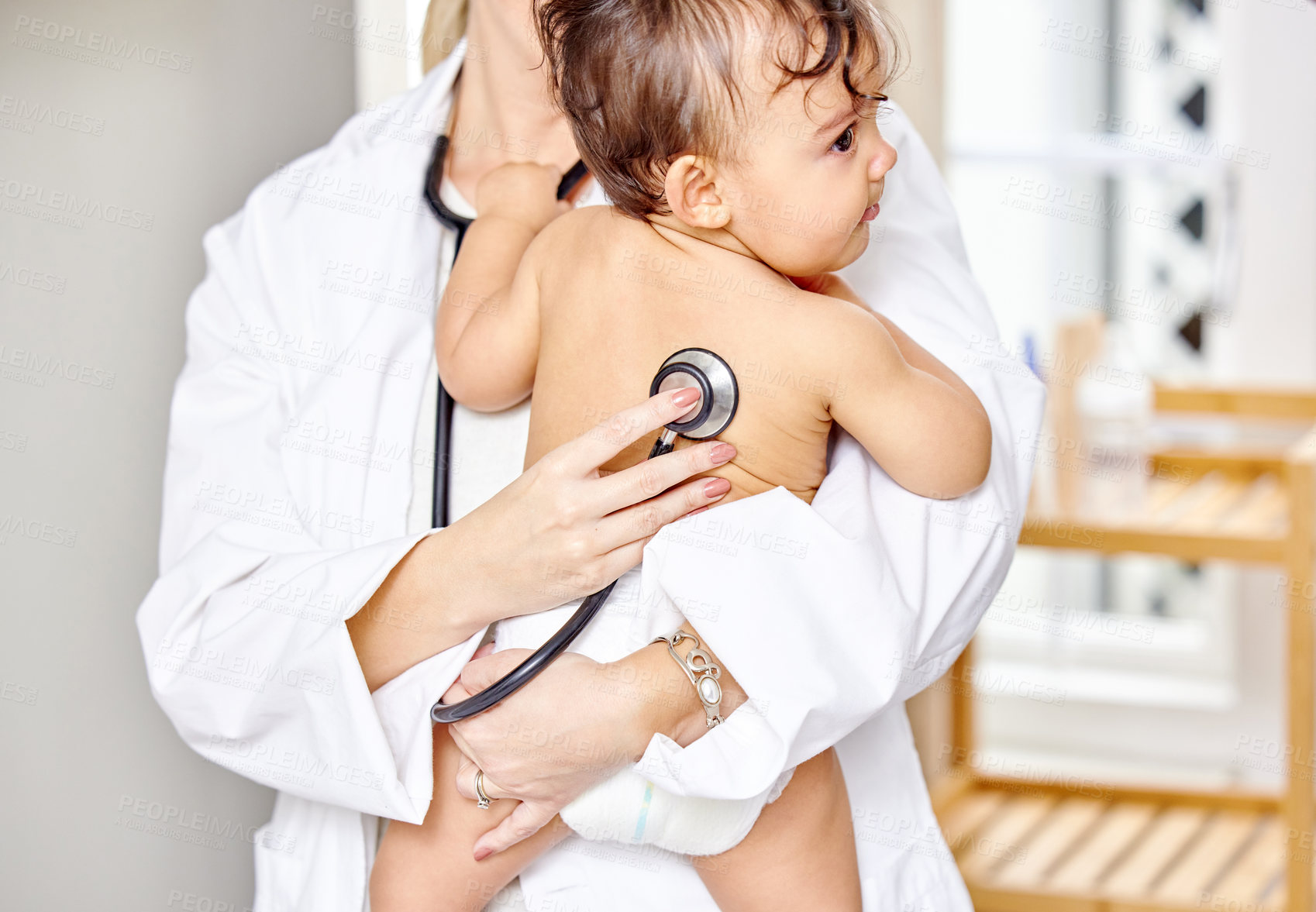 Buy stock photo Sick kid, pediatrician and baby with stethoscope for check up, healthcare and illness in family clinic. Child, female physician and hospital room for unwell infant, heart results and medical exam