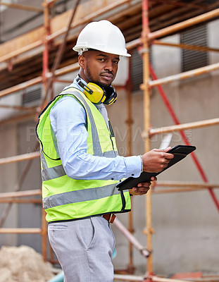 Buy stock photo Shot of a young man working on a construction site outside