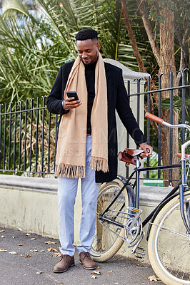 Buy stock photo Happy, black man and smartphone with bicycle in city for eco friendly transportation and online on social media. Person, mobile phone and search for reviews or destinations for tours on vacation.