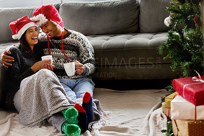 Buy stock photo Shot of a young couple sitting on the floor at home