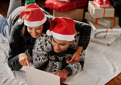 Buy stock photo Shot of a couple watching movies on a laptop at home
