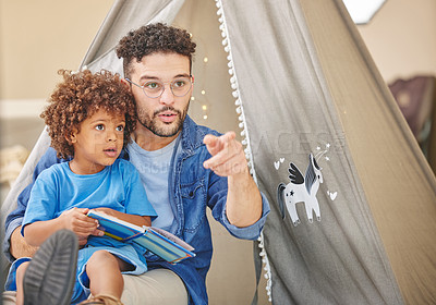 Buy stock photo Family, reading and father and child with book for story time, child development and bonding in bedroom. Happy, relax and dad with young boy with novel for fantasy, storytelling and education in home
