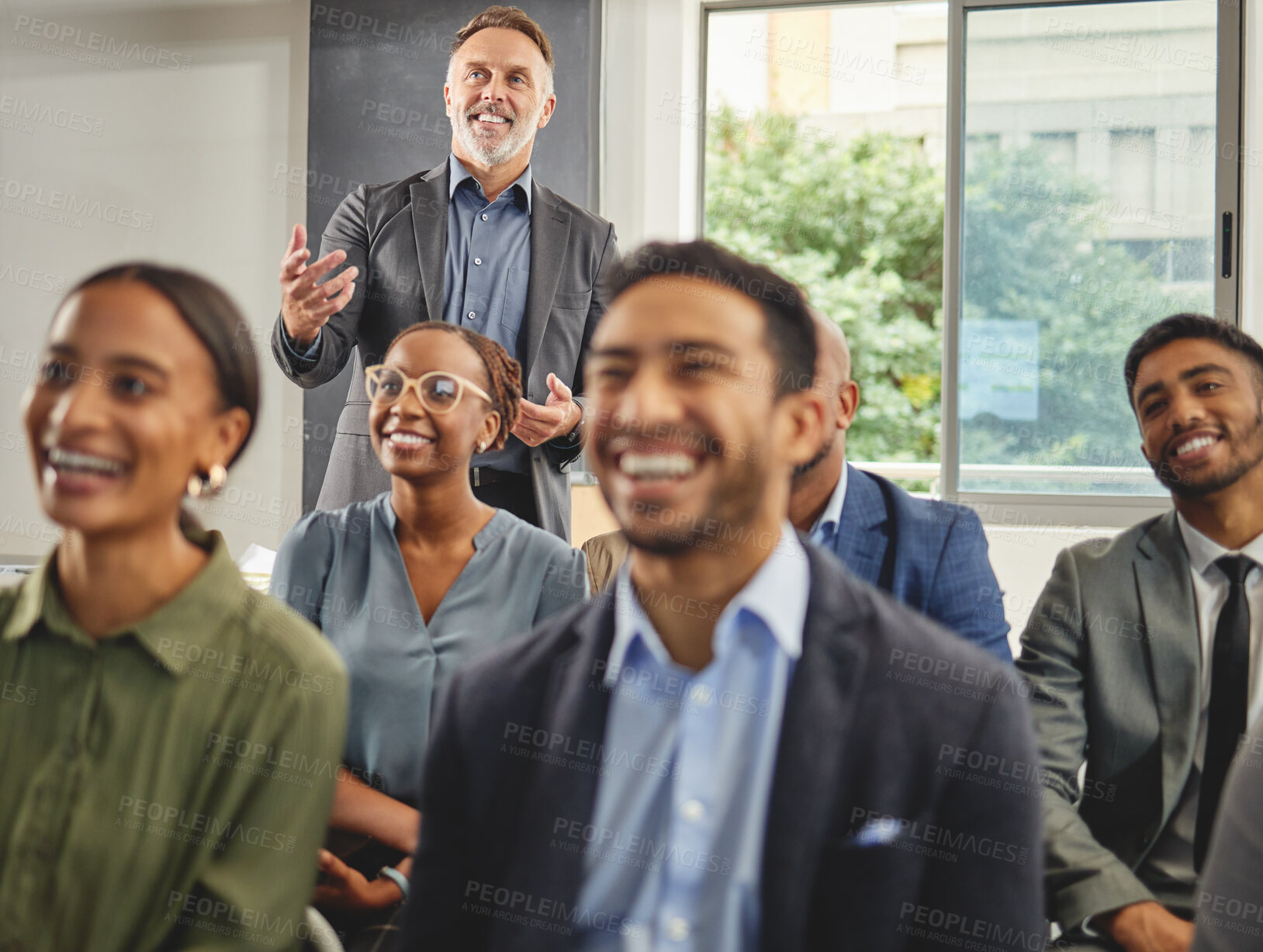 Buy stock photo Shot of a group of businesspeople having a meeting in a boardroom at work