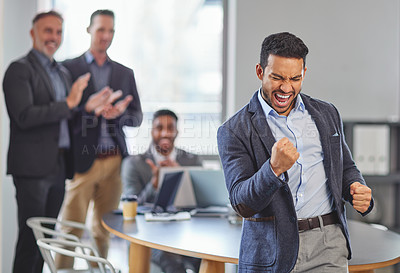 Buy stock photo Excited, businessman and winning with celebration for success, promotion or achievement at office. Young man or employee with group in applause for congratulations, meeting or business accomplishment