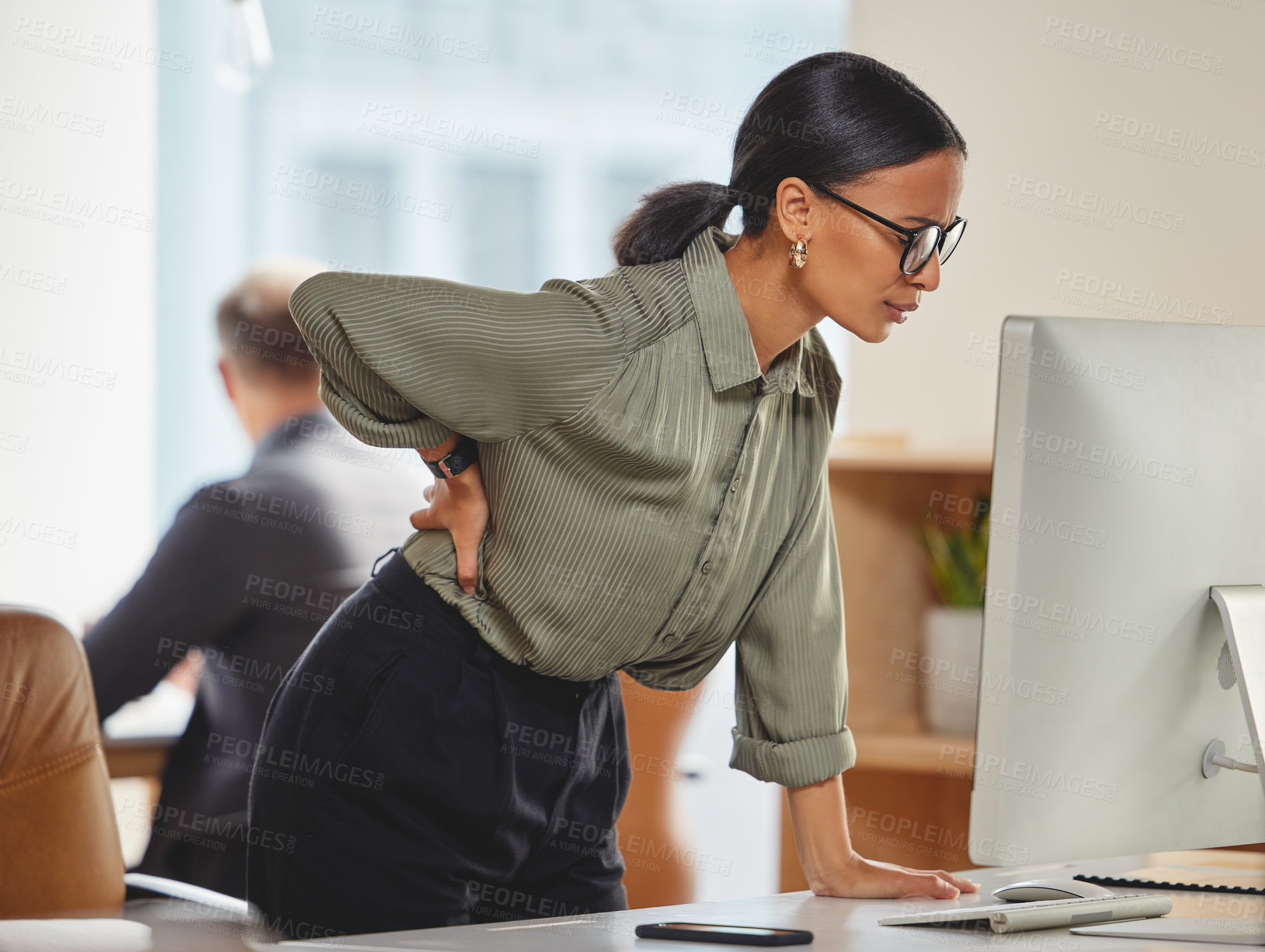 Buy stock photo Back pain, woman in office at desk with computer and burnout, deadline pressure and glasses at work. Tired, overworked and overwhelmed businesswoman at pc with injury, cramp or muscle ache at startup
