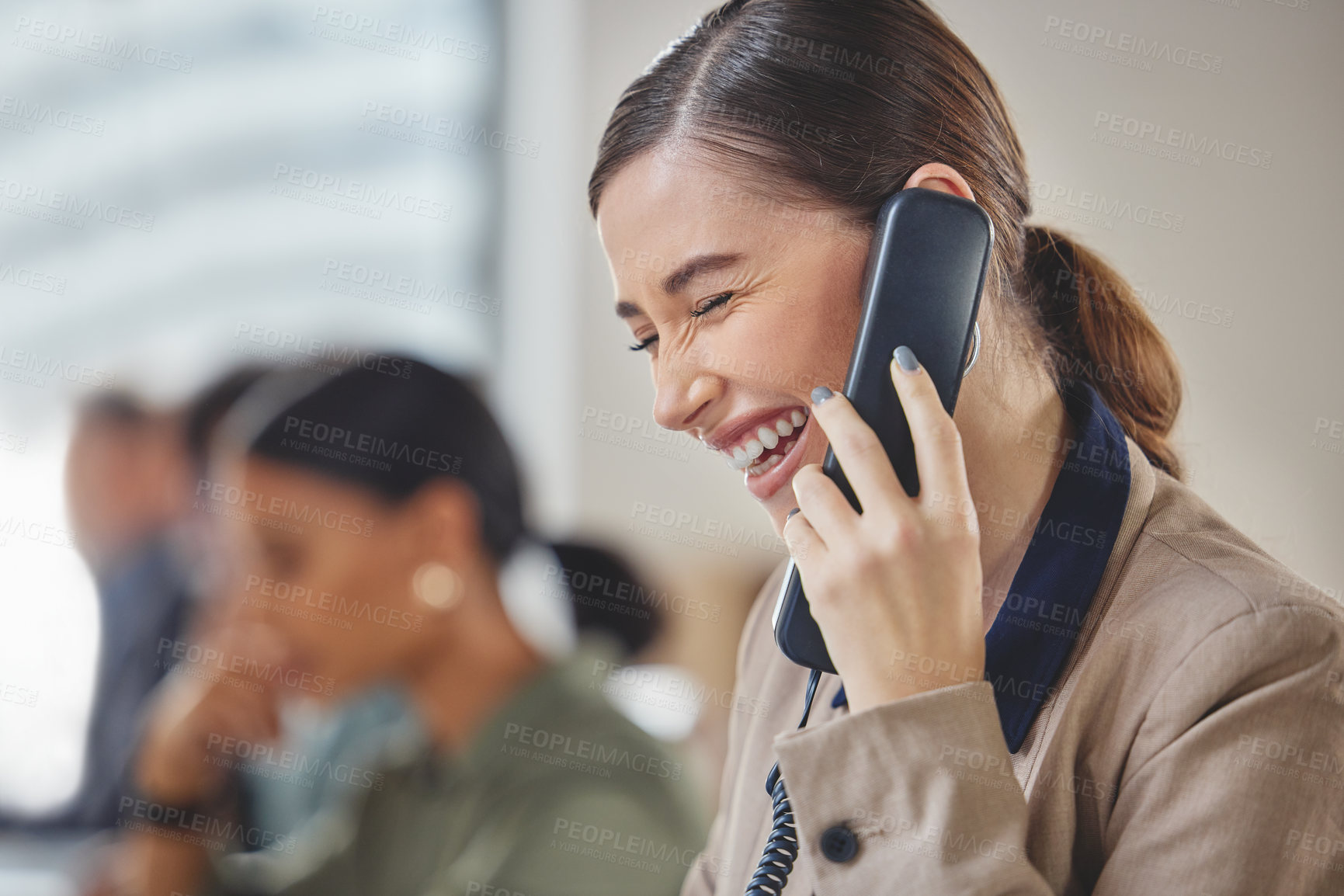 Buy stock photo Office, laugh and woman on landline phone call in networking, sales or contact at agency. Telephone, communication and happy consultant with advice, conversation or lead generation in coworking space