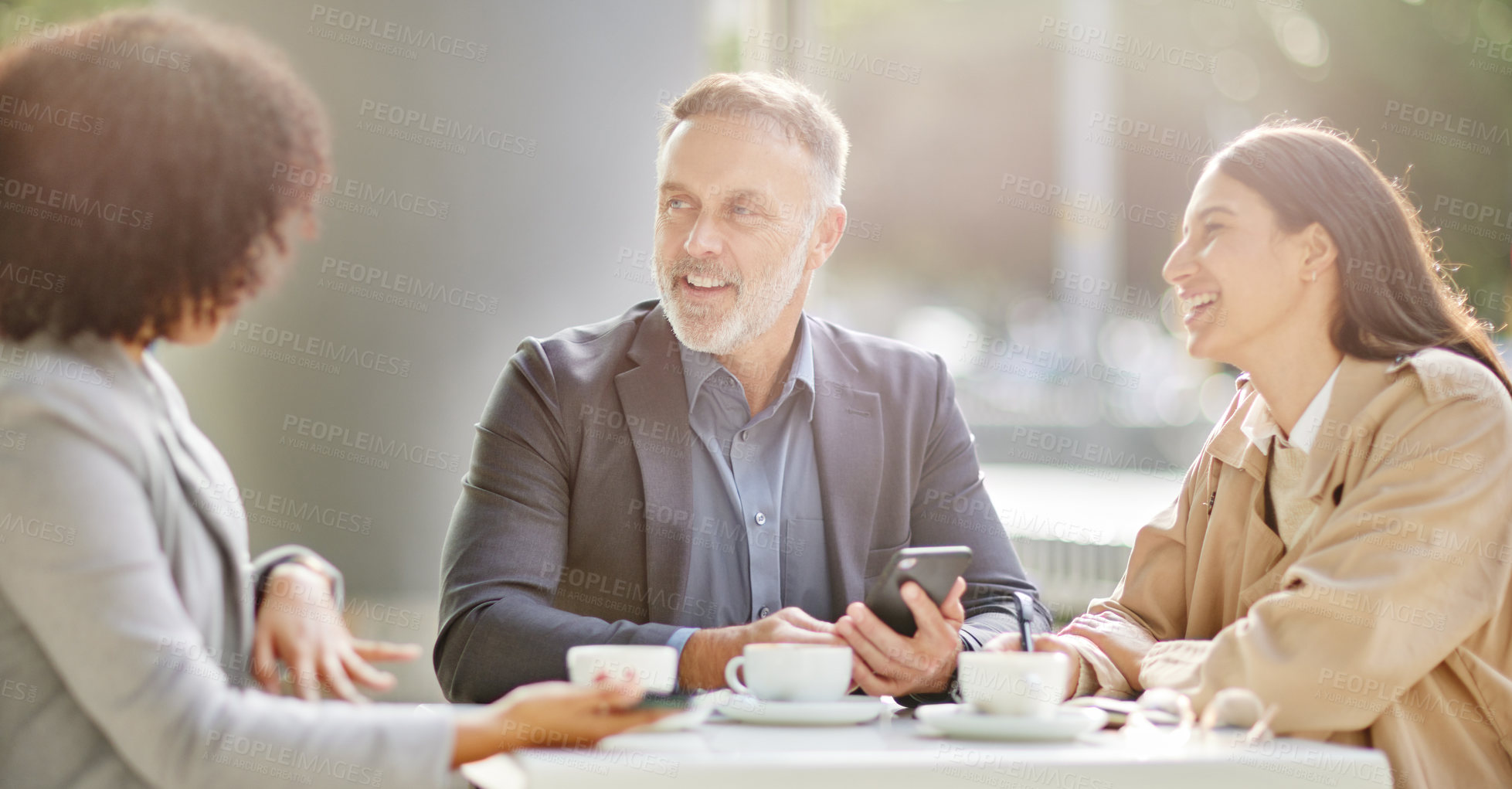 Buy stock photo Business people, coffee shop and meeting for conversation, smile or team building for planning in morning. Businessman, women and smartphone at cafe with talk for vision, motivation and brainstorming