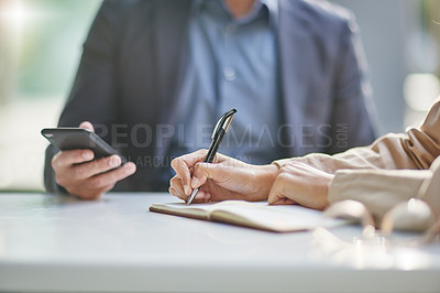 Buy stock photo Meeting, hands and writing in notebook with business people in strategy collaboration closeup and teamwork. Using phone, research and notes with ideas, planning with teamwork and working together