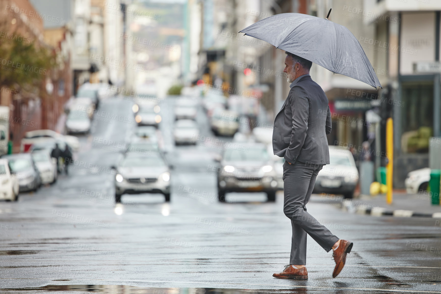 Buy stock photo Walking, city and business man with umbrella for morning commute, travel and journey to workplace in winter. Professional, corporate and person in urban town for career, job and work in New York
