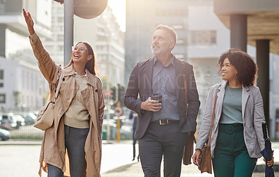 Buy stock photo Shot of a group of colleagues walking around together