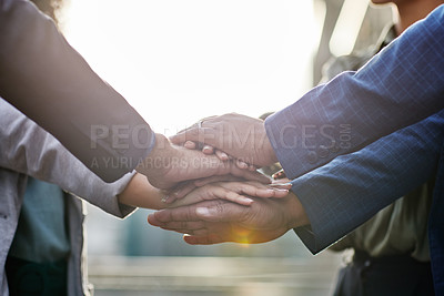 Buy stock photo Shot of a group of business people with their hands stacked together