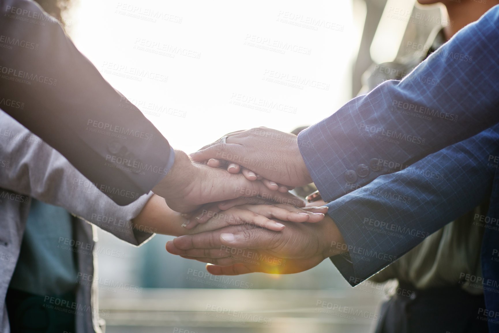 Buy stock photo Shot of a group of business people with their hands stacked together