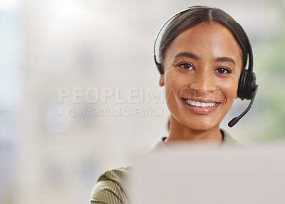 Buy stock photo Shot of a call centre agewnt smiling while sitting at her desk