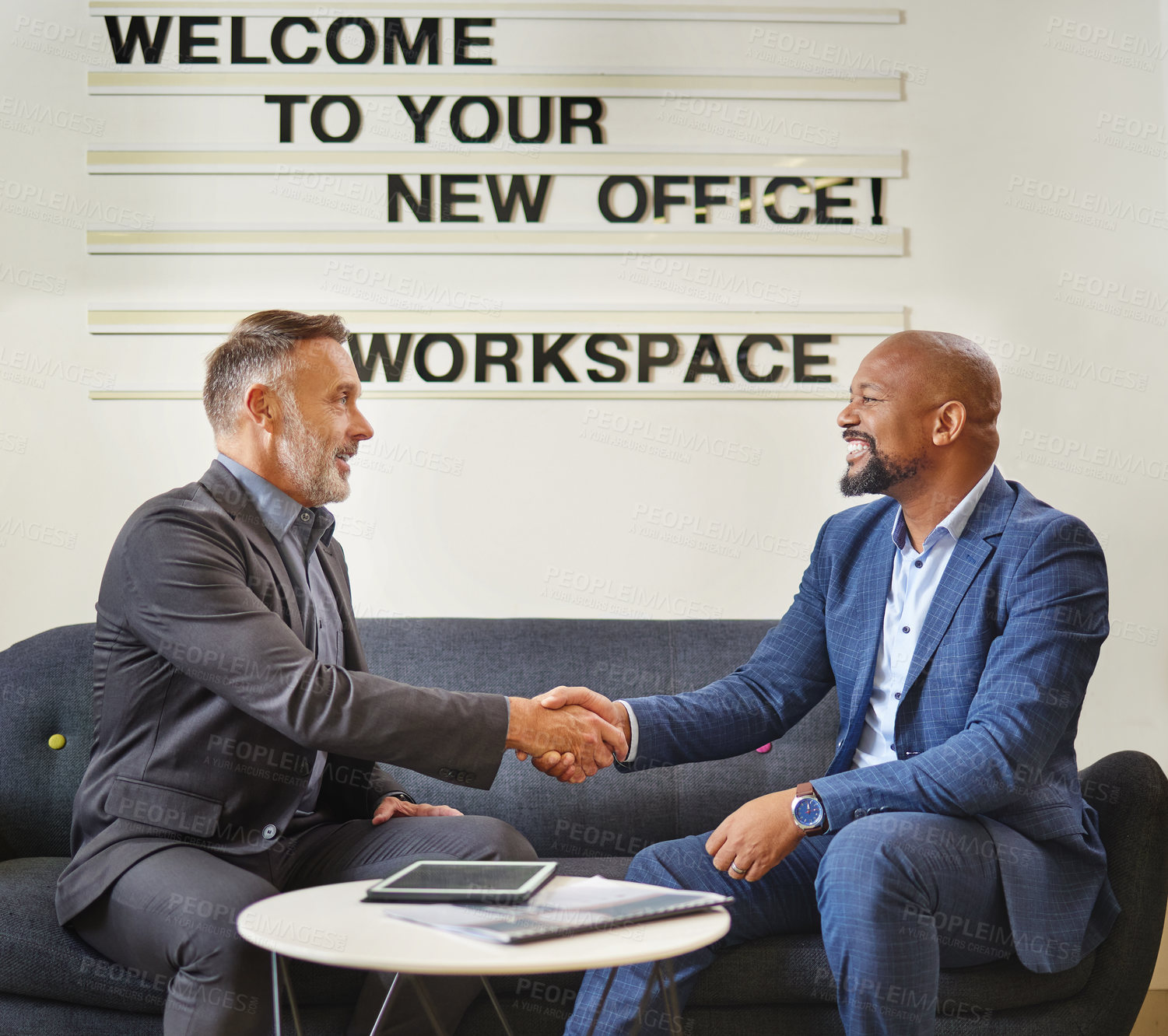 Buy stock photo Businessman, handshake and interview with executive at office for partnership, agreement or deal. Man or employee shaking hands with CEO in meeting for hiring, recruiting or b2b on sofa at workplace