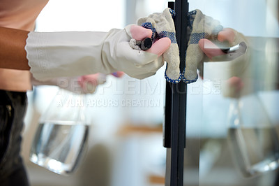 Buy stock photo Shot of an unrecognizable person cleaning a door handle at home