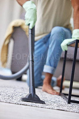 Buy stock photo Shot of an unrecognizable person vacuuming at home