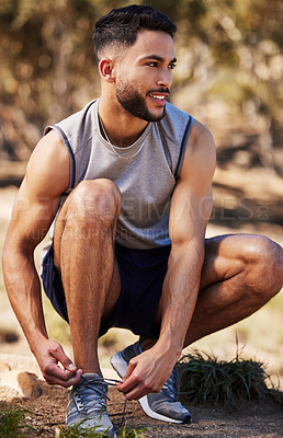 Buy stock photo Man, runner and tying laces in nature, prepare and ready for exercise or outdoor fitness. Male person, athlete and sneakers for jog or marathon training, gear and footwear for sports or wellness