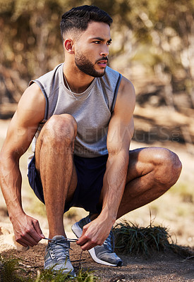 Buy stock photo Man, runner and tying laces in outdoors, prepare and ready for workout or nature fitness. Male person, athlete and sneakers for jog or marathon training, gear and footwear for sports or wellness