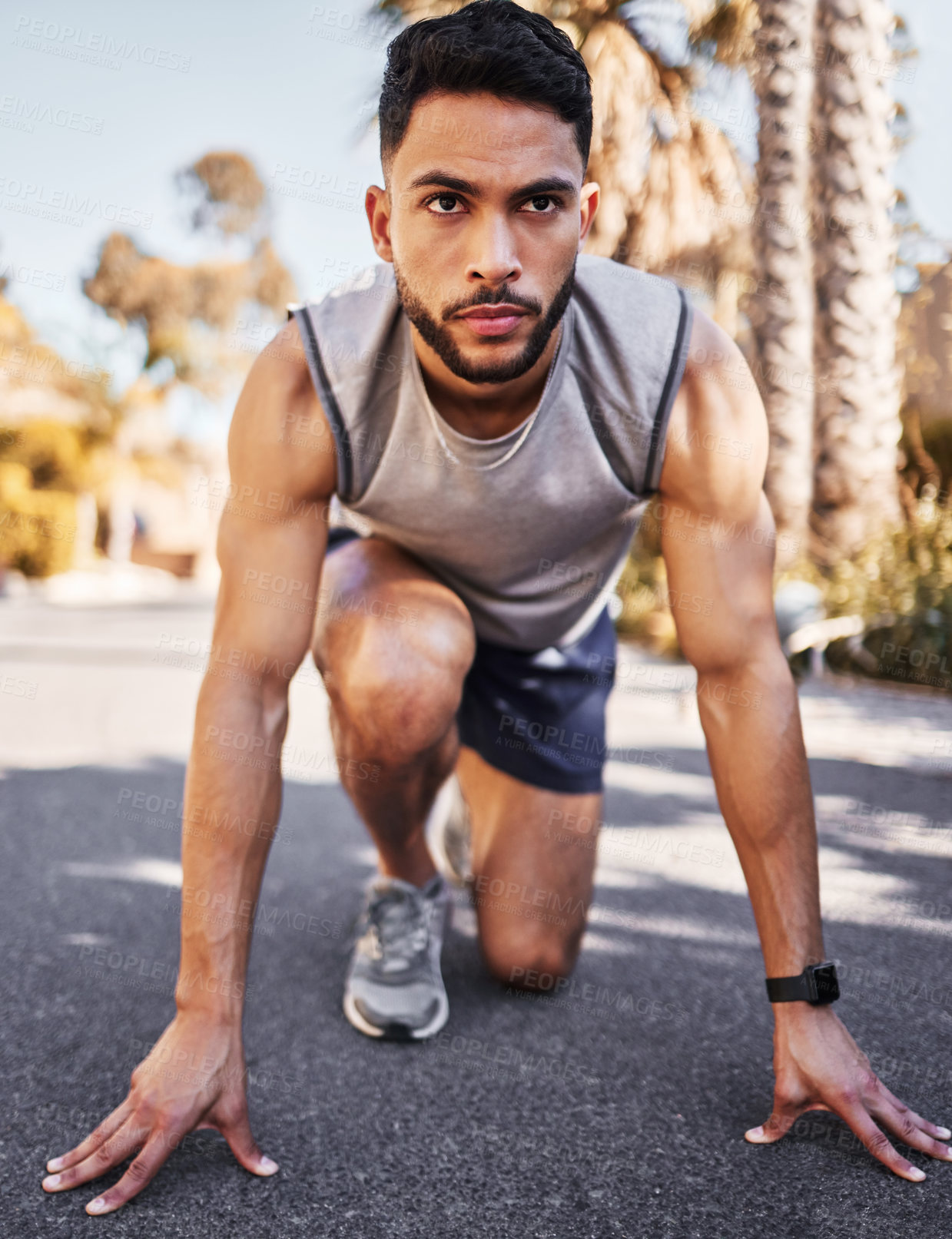 Buy stock photo Man, runner and start line for sport, fitness and exercise in race or competition on road or street. Serious, male athlete,  and ready to start running for marathon training and muscle development