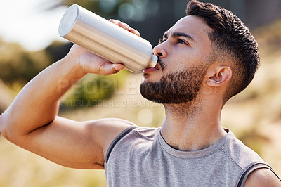Buy stock photo Man, drinking or water in countryside or runner with bottle, workout or exercise for health. Male, athlete and liquid in container for sports in nature, trail marathon or running for wellness in Iraq