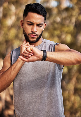 Buy stock photo Heart rate, check and man or runner outdoor for morning cardio, exercise and training for marathon or race. Male athlete, smart watch or stopwatch to track pulse for endurance, wellness and health.