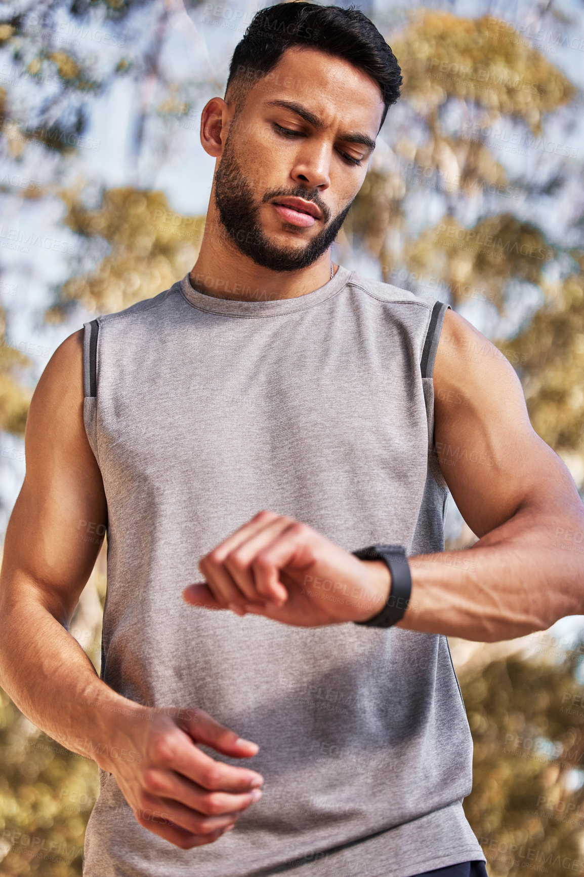 Buy stock photo Smart watch, time and man or runner outdoor for morning cardio, exercise and training for marathon or race. Male athlete, wristwatch or stopwatch to track progress for workout or wellness and health.
