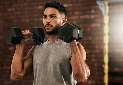 Buy stock photo Weightlifting, fitness and man with dumbbell in gym for exercise, bodybuilder training and workout. Sports, strong muscles and serious male person lifting weight for wellness, healthy body and cardio