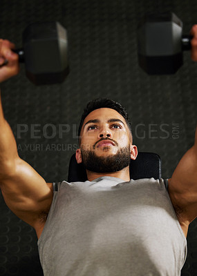 Buy stock photo Bench press, workout and man with weight in gym for fitness, bodybuilder training and exercise. Sports, strong muscle and serious male person lifting weight for wellness, healthy body and strength
