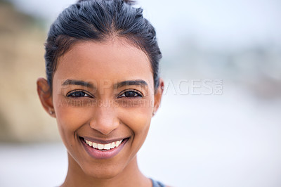 Buy stock photo Indian woman, portrait and happiness at beach for vacation, travel and weekend for relax in nature. Happy female person, holistic and healthy outside for yoga, meditation and time off in coastal town