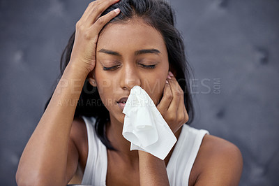 Buy stock photo Shot of a woman feeling ill while sitting at home
