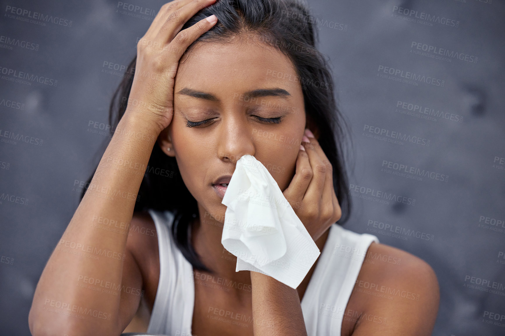 Buy stock photo Shot of a woman feeling ill while sitting at home