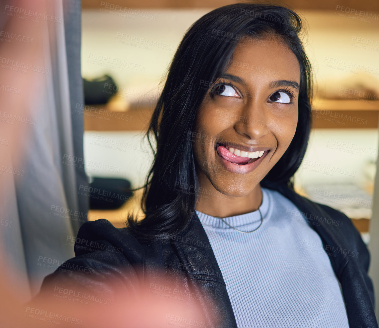Buy stock photo Smile, selfie or Indian girl shopping in mall with funny face for fashion, discount or social media app. Gen z influencer, photography or woman in retail boutique with profile picture or tongue out