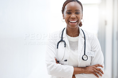 Buy stock photo Shot of a beautiful young doctor in the hospital