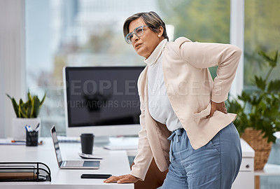 Buy stock photo Business woman, back pain and office and with injury, tired and spine problem standing at table. Medical emergency, stress and executive massage for body strain, accident and tension or fatigue