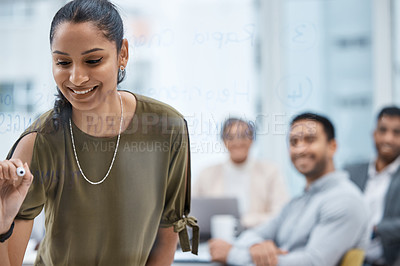 Buy stock photo Shot of a young businesswoman writing notes on a glass screen during a meeting in an office