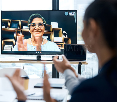 Buy stock photo Shot of a group of businesspeople applauding during a video call with a colleague in an office