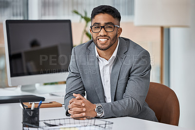 Buy stock photo Portrait of a young businessman working in an office