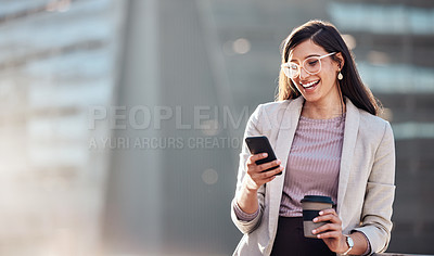 Buy stock photo Shot of an attractive young businesswoman standing alone outside and using her cellphone