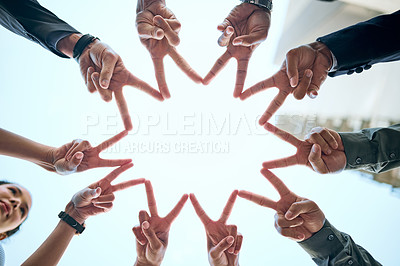 Buy stock photo Shot of a group of unrecognizable businesspeople making a star shape with their hands