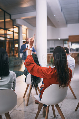 Buy stock photo Shot of an unrecognizable businessperson raising their hand to ask a question during a conference at work