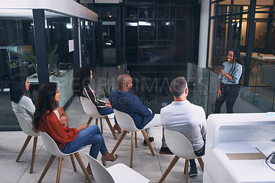 Buy stock photo Shot of a group of businesspeople attending a conference at work