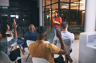 Buy stock photo Shot of a group of businesspeople attending a conference at work